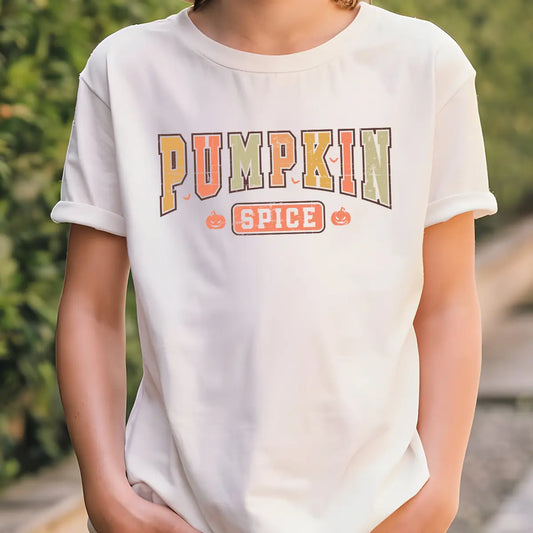White t-shirt with retro block lettering “Pumpkin Spice” in orange, green, and brown tones, accented with small pumpkins, fall-themed DTF transfer design.