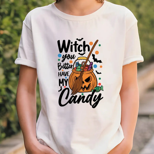 White t-shirt with colorful Halloween design featuring jack-o’-lantern candy bucket, broomstick, bats, polka dots, and text “Witch You Better Have My Candy.”