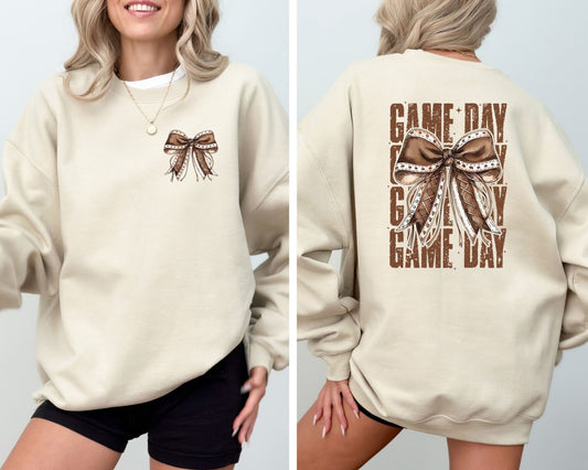 Beige sweatshirt featuring a Game Day Bow DTF transfer design in brown tones