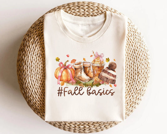 Cream sweater with '#Fall Basics' DTF transfer depicting autumn essentials like boots, a pumpkin, and a knit hat