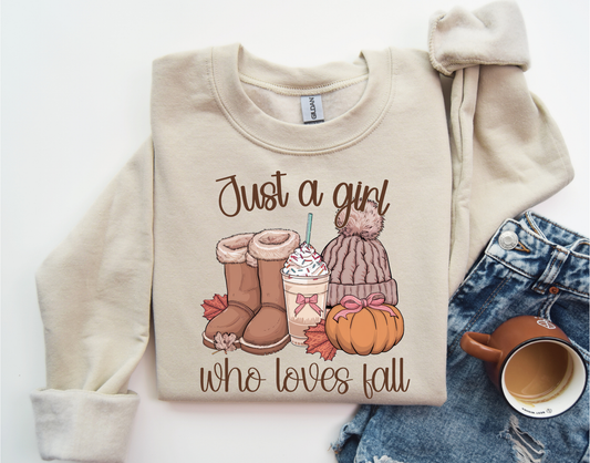 Beige sweatshirt with 'Just a Girl Who Loves Fall' DTF transfer featuring autumn-themed items like boots and a pumpkin