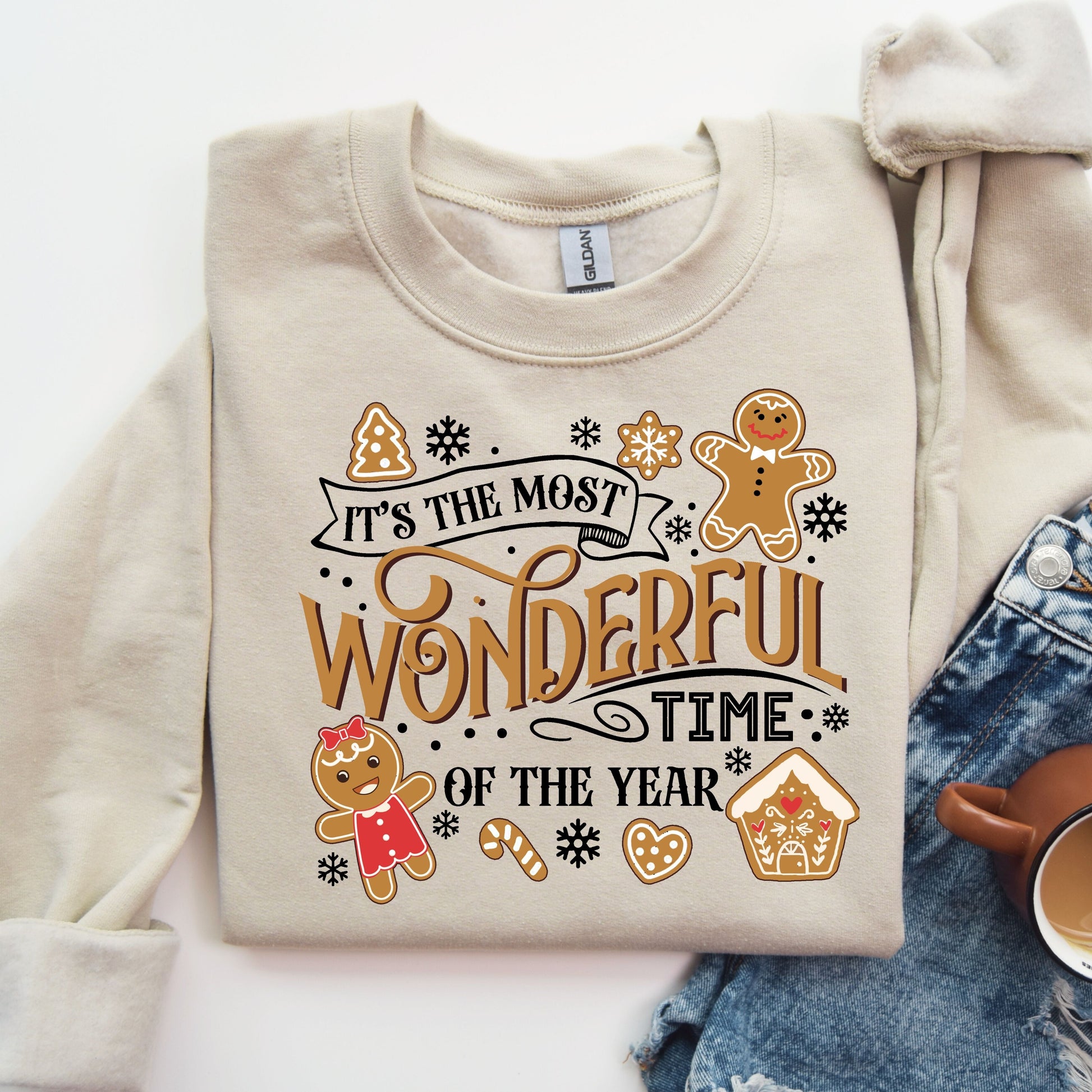 Beige sweatshirt with 'It's the Most Wonderful Time of the Year' Christmas-themed DTF transfer featuring festive cookies and decorations