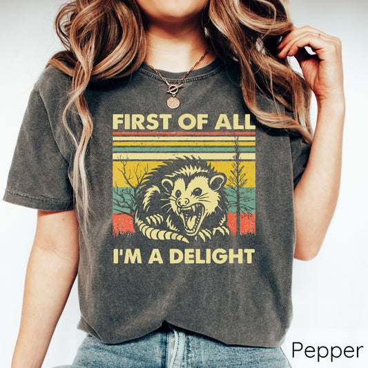 First of All, I'm a Delight opossum graphic on a t-shirt