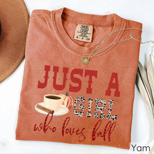 Just a Girl Who Loves Fall graphic on a yam-colored t-shirt