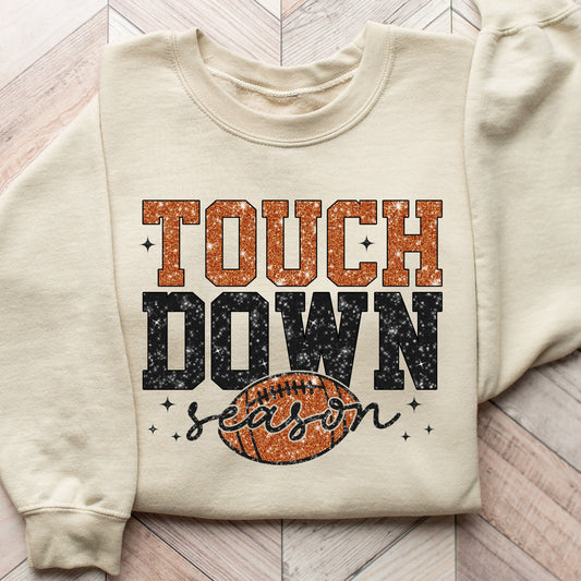 Touchdown Season football-themed DTF transfer design on a beige sweatshirt