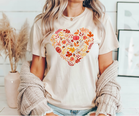 Heart-shaped autumn-themed DTF transfer design on a cream t-shirt