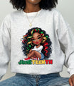 Person wearing a gray sweatshirt with a Juneteenth DTF Transfer design.