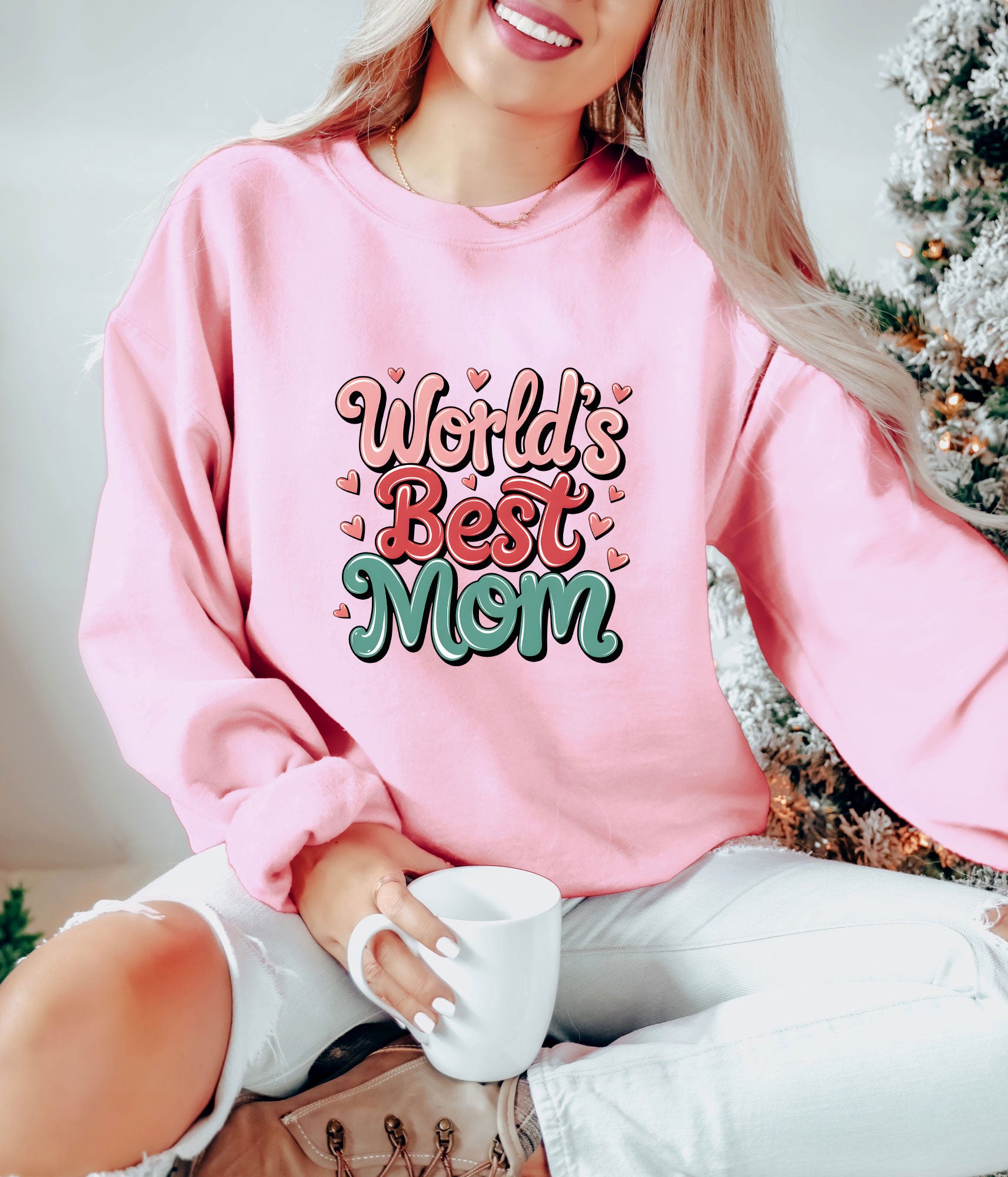 "World's Best Mom" ready-to-press DTF transfer design on a pink sweatshirt