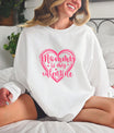 Smiling woman wearing a white sweatshirt with a pink Mommy is My Valentine heart DTF Transfer, perfect for Valentine’s Day.