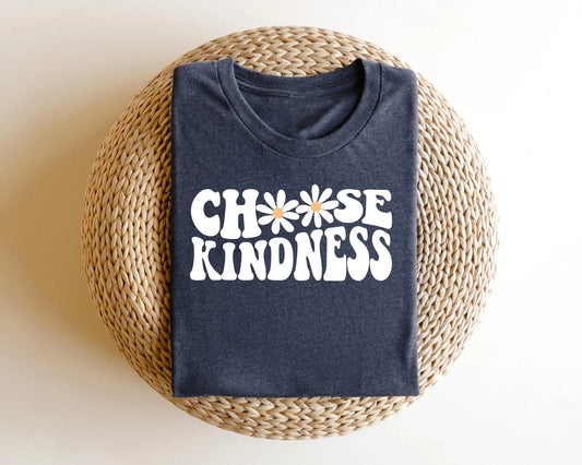 "Choose Kindness" DTF transfer design on a dark gray t-shirt featuring retro bubble text with daisy accents.