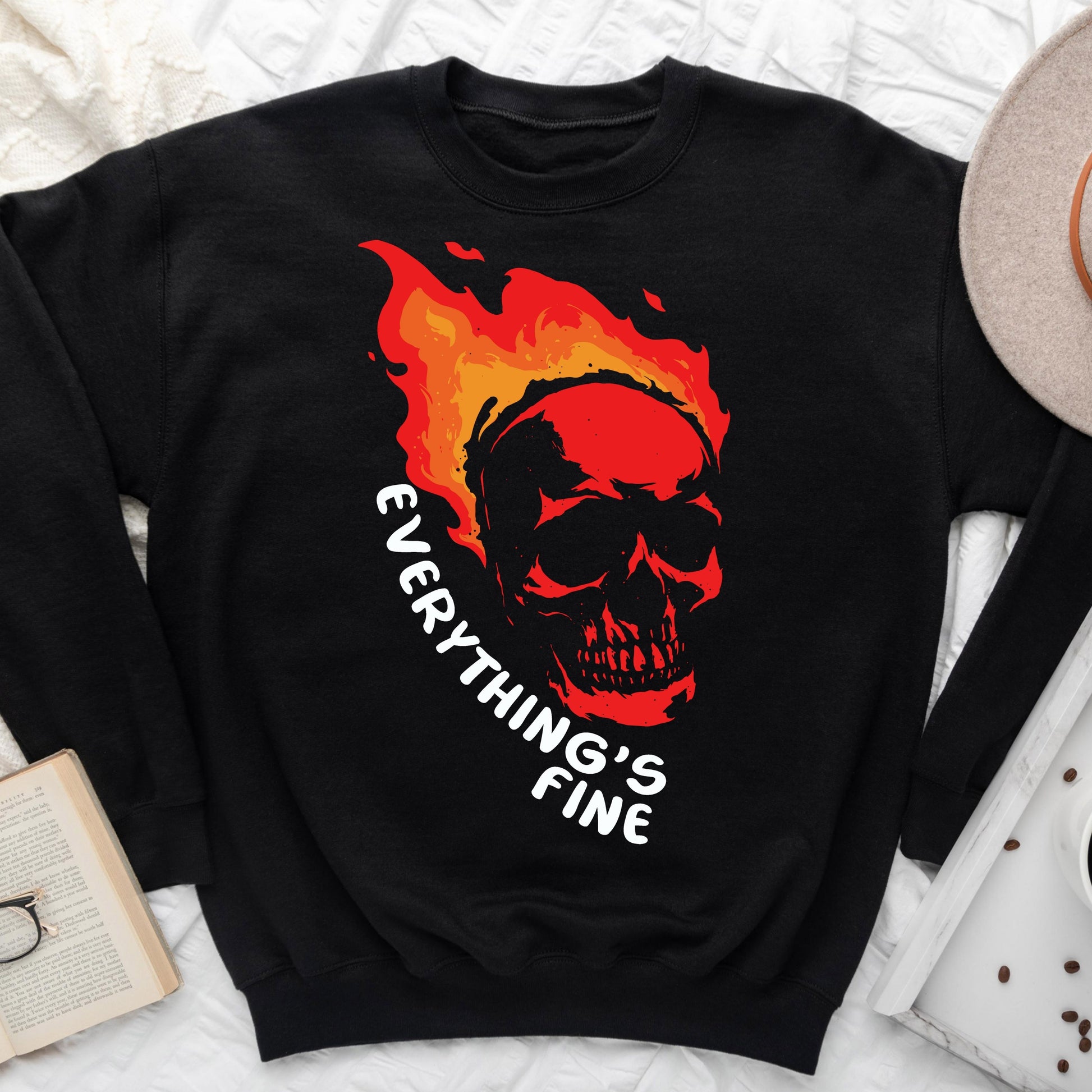 "Everything's Fine" DTF transfer design on a black sweatshirt featuring a flaming skull with vibrant red and orange flames and bold text.