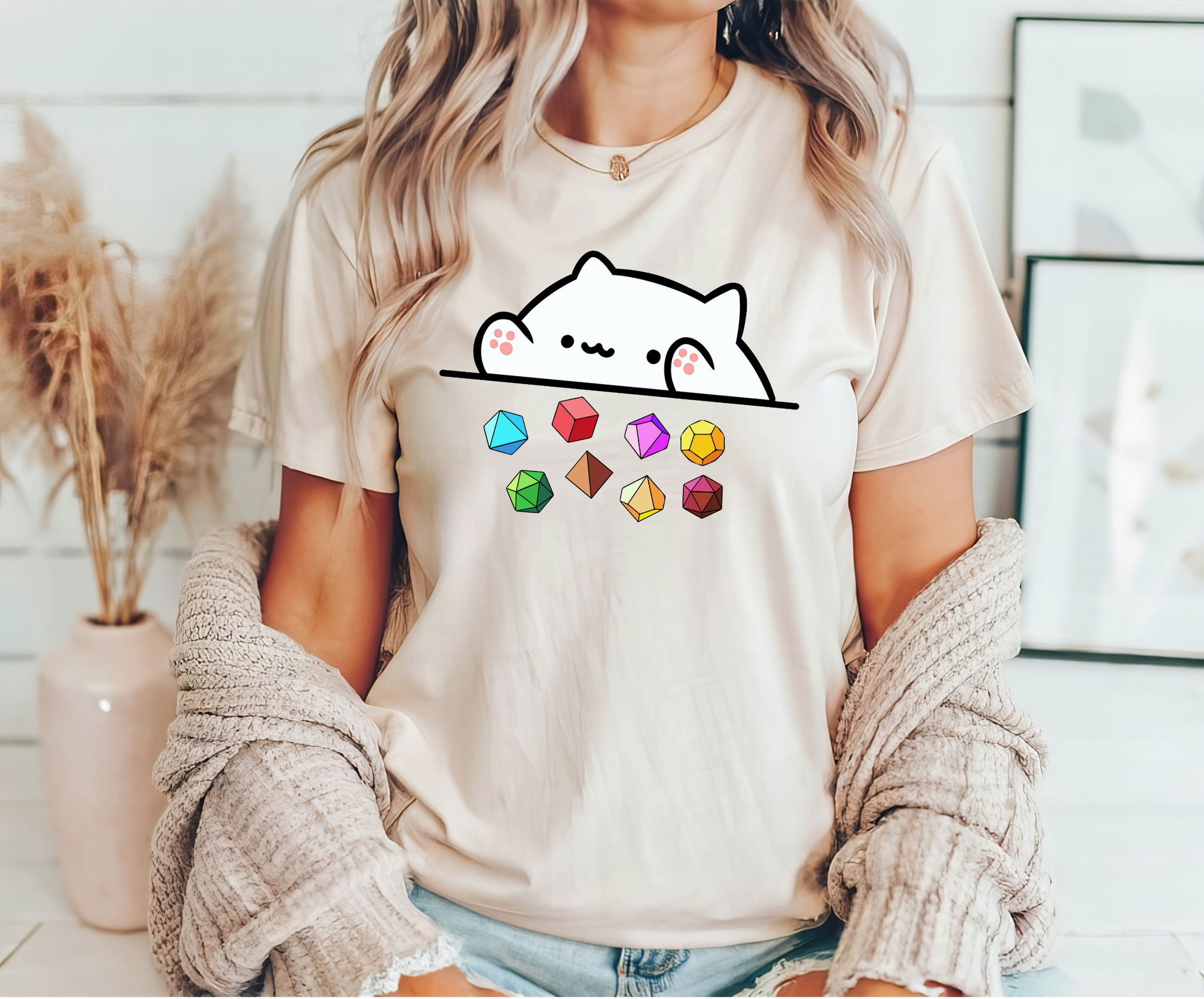 "Cat and Gems" DTF transfer design on a white t-shirt featuring an adorable cat peeking over colorful gemstones.