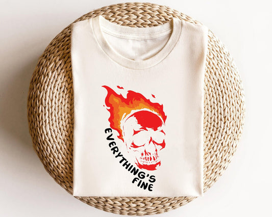 "Everything's Fine" flaming skull DTF transfer design on a white t-shirt, showcasing bold colors and edgy artwork.