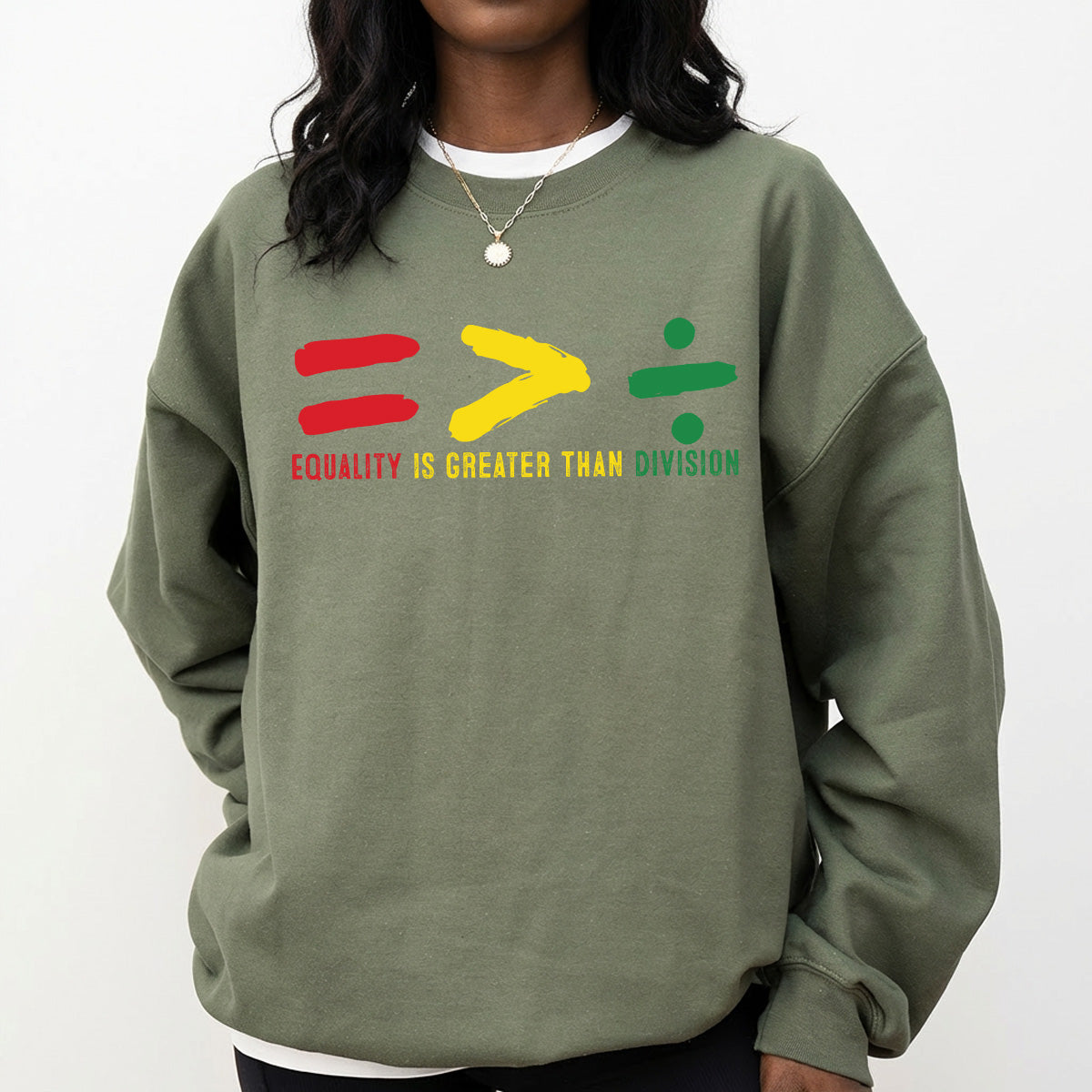 Shirt featuring a Black History-themed DTF transfer. Equality is Greater Than Division text