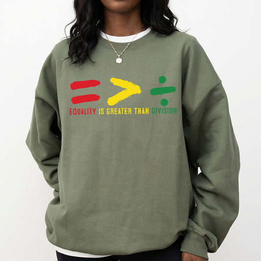 Shirt featuring a Black History-themed DTF transfer. Equality is Greater Than Division text