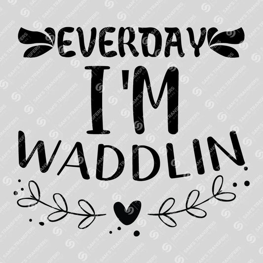 Apparel featuring a Everyday I'm Waddlin-themed DTF transfer.