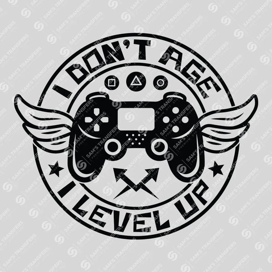 Apparel featuring a I Don't Age I Level Up-themed DTF transfer.