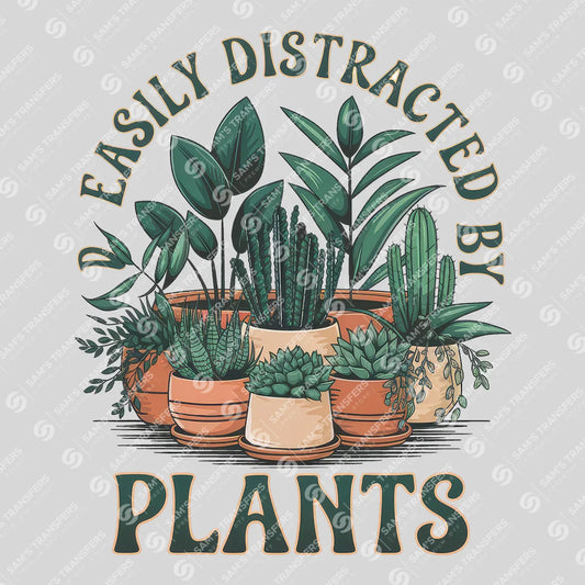 Apparel featuring a Easily Distracted By Plants-themed DTF transfer.