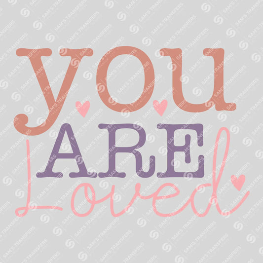 Apparel featuring a You Are Loved-themed DTF transfer.