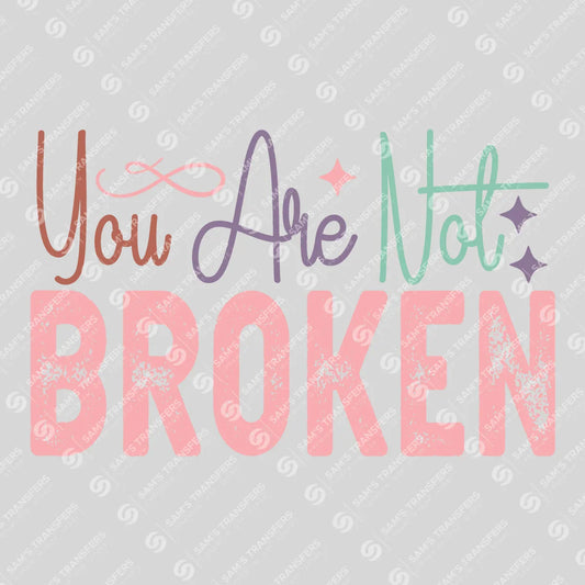 Apparel featuring a You Are Not Broken-themed DTF transfer.