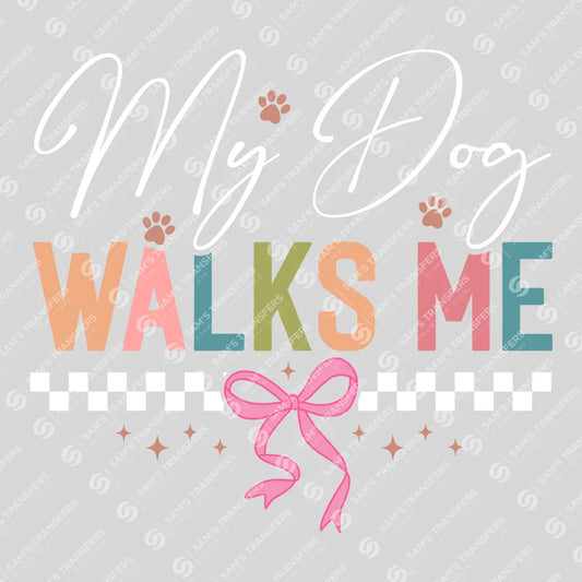 Apparel featuring a My Dog Walks Me-themed DTF transfer.