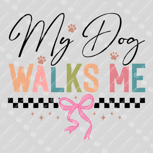 Apparel featuring a My Dog Walks Me-themed DTF transfer.