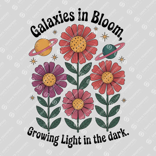 Apparel featuring a Galaxies In Bloom Growing Light In The Dark-themed DTF transfer.