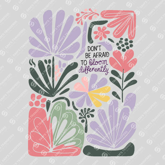 Apparel featuring a Don't Be Afraid To Bloom Differently-themed DTF transfer.