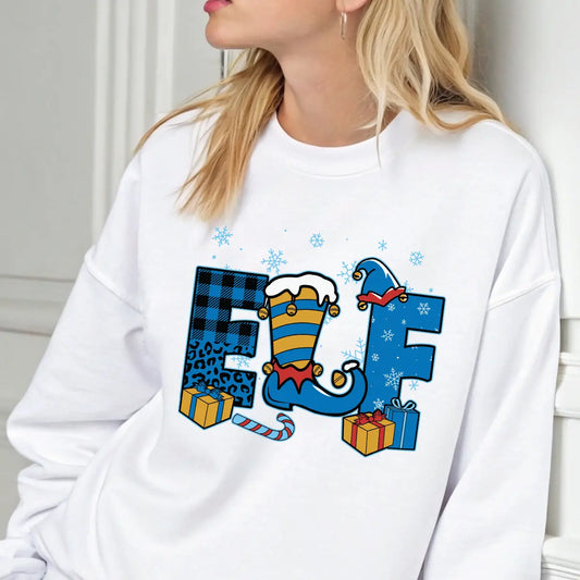 White sweatshirt with “ELF” DTF transfer design featuring blue plaid, striped elf leg, presents, candy cane, and snowflakes—perfect for fun holiday wear.
