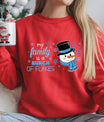 Red sweatshirt with “My Family Is a Bunch of Flakes” DTF transfer featuring a cute snowman in a blue scarf and top hat surrounded by snowflakes—perfect for funny holiday apparel.