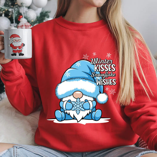Red sweatshirt with “Winter Kisses Snowflake Wishes” DTF transfer featuring a cute gnome in a blue hat holding a snowflake, surrounded by snowflakes—perfect for winter apparel.