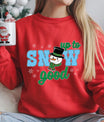Red sweatshirt with “Up to Snow Good” DTF transfer featuring a smiling snowman in a top hat and plaid scarf surrounded by snowflakes—perfect for fun holiday apparel.