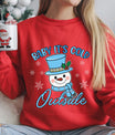 Red sweatshirt with “Baby It’s Cold Outside” DTF transfer featuring a smiling snowman in a blue hat and scarf with snowflakes—perfect for cozy holiday apparel.