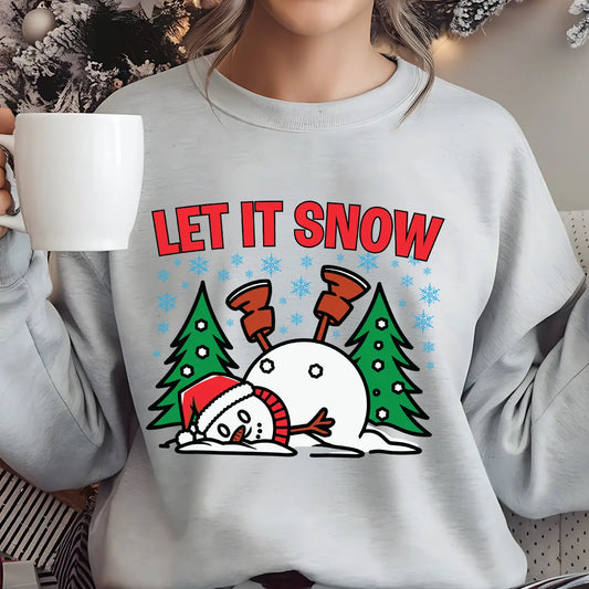 Light gray sweatshirt with “Let It Snow” DTF transfer featuring a funny fallen snowman between two Christmas trees and snowflakes—perfect for humorous winter apparel.