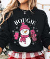Black sweatshirt with “Bougie” DTF transfer featuring a smiling snowman in a pink hat and scarf holding coffee cups, surrounded by snowflakes—perfect for chic winter apparel.