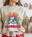 Beige sweatshirt with colorful retro “Chillin’ With My Snowmies” DTF transfer design featuring a happy snowman family in front of a striped sunset background.