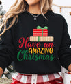 Black sweatshirt with “Have an Amazing Christmas” text and stacked red and beige gift boxes design — cheerful holiday sweatshirt.