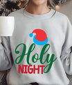 Grey sweatshirt with “Holy Night” text and red-blue Santa hat design — minimal Christmas sweatshirt.