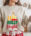 Sand-colored sweatshirt with “O Holy Night” text and candle design in red, gold, and green – elegant Christian Christmas apparel.
