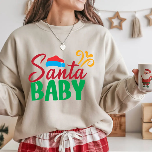 Beige sweatshirt with “Santa Baby” text in festive red and green colors with a Santa hat graphic, cozy Christmas apparel.