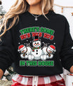 Black sweatshirt featuring three cheerful snowmen and the phrase “There’s Some Ho’s In This House” in red and green Christmas colors.