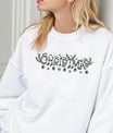 White sweatshirt featuring a black-and-white “Christmas” DTF transfer design with reindeer antlers, ornaments, and snowflakes—simple and elegant festive style.
