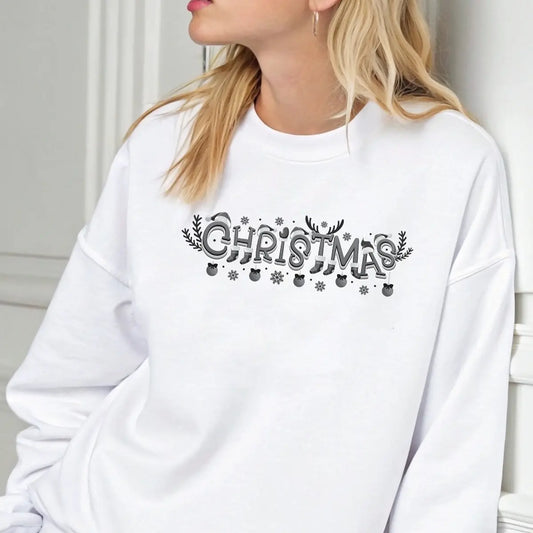 White sweatshirt featuring a black-and-white “Christmas” DTF transfer design with reindeer antlers, ornaments, and snowflakes—simple and elegant festive style.