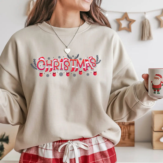 Beige sweatshirt featuring a red and white “Christmas” DTF transfer design with Santa hats, stockings, snowflakes, and ornaments—festive and cheerful holiday style.