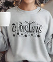 Gray sweatshirt featuring a black “Christmas” DTF transfer design with Santa hat, reindeer, presents, and ornaments—minimal and elegant festive apparel.