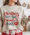 Beige sweatshirt featuring the phrase “Christmas Candy Canes Cocoa & Chaos” in red and navy lettering with candy canes, cocoa mug, and snowflakes—festive holiday design.