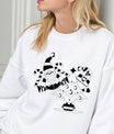 White sweatshirt featuring black outline artwork of Santa Claus holding candy canes beside a decorated Christmas tree—minimal and festive Christmas DTF design.