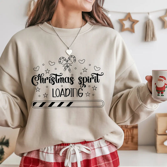 Sand-colored sweatshirt with “Christmas Spirit Loading” DTF design featuring candy canes, hearts, and progress bar graphic.