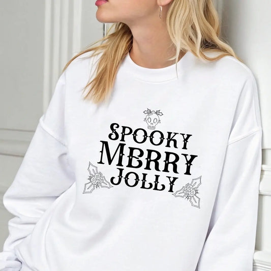 White sweatshirt with “Spooky Merry Jolly” Gothic Christmas DTF design featuring skull and holly leaf accents.