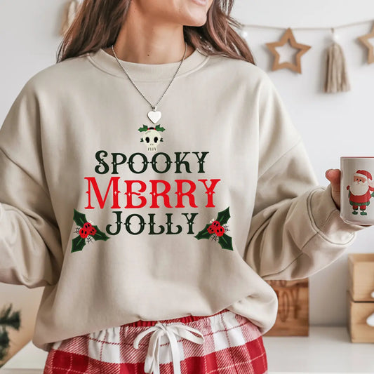 Beige Christmas sweatshirt with red and green “Spooky Merry Jolly” DTF design featuring skull and holly accents.